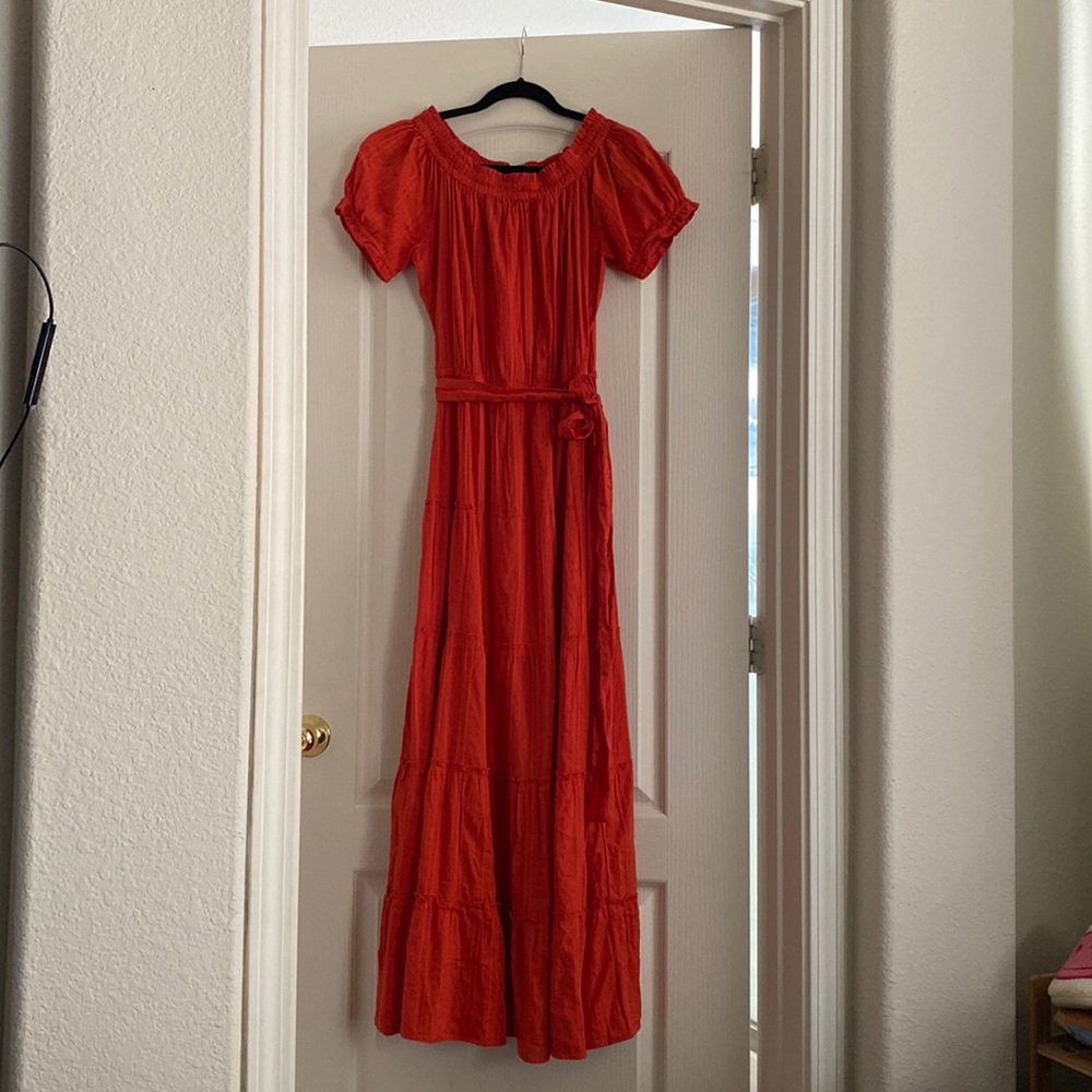 Orange ruffle dress.